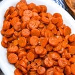 easy 5 minute brown sugar glazed canned carrots in a white serving bowl