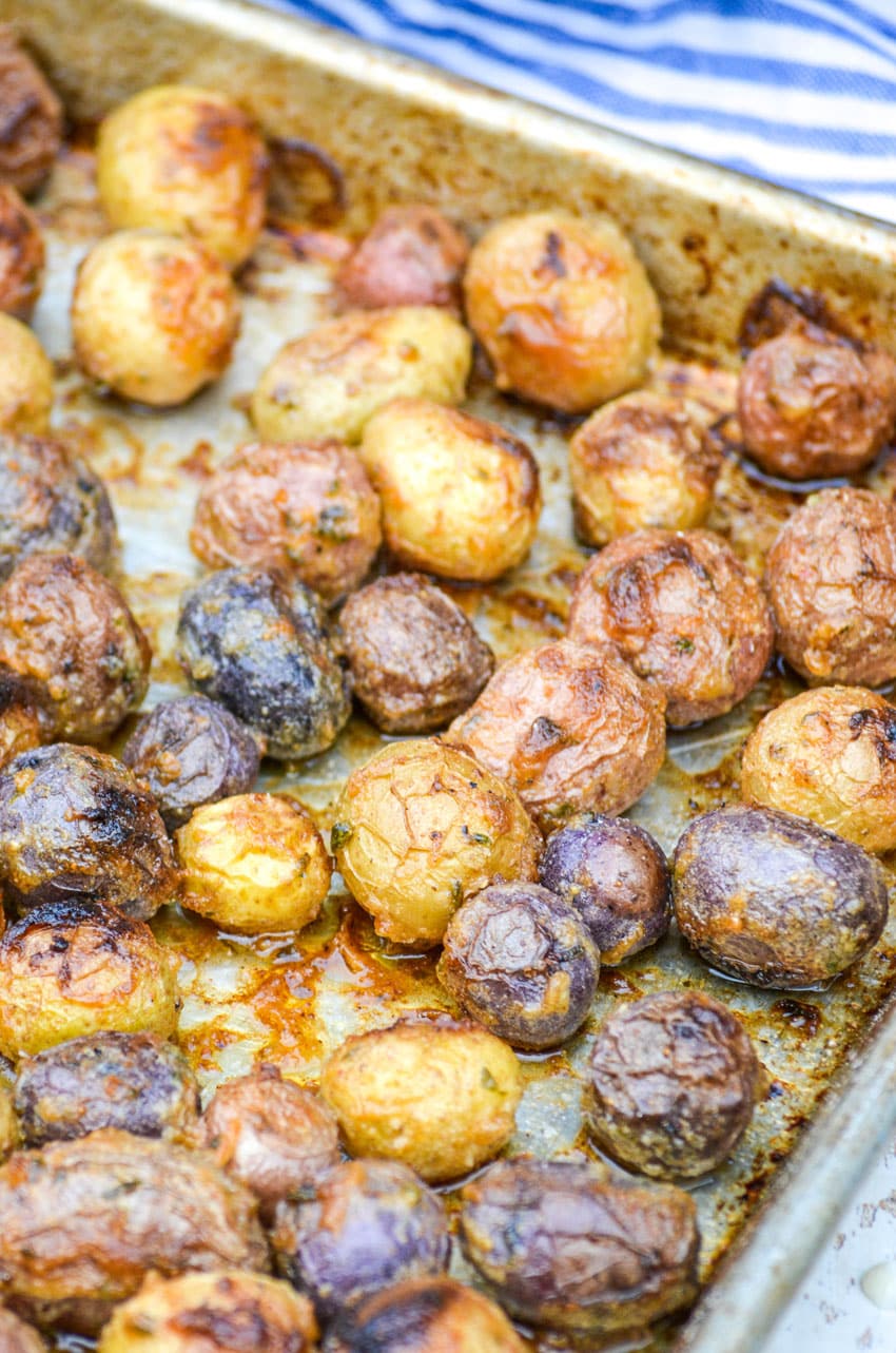 mayonnaise roasted potatoes on a rimmed baking sheet