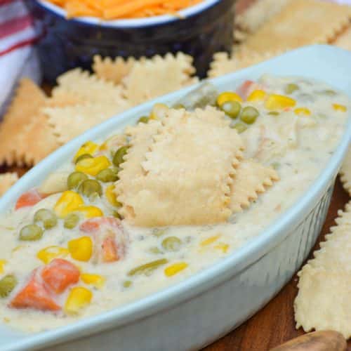 pie crust crackers sitting in the center of a bowl of chicken soup