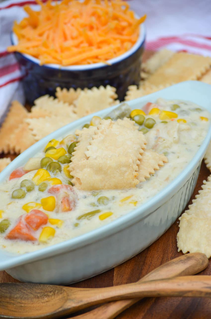 pie crust crackers sitting in the center of a bowl of chicken soup