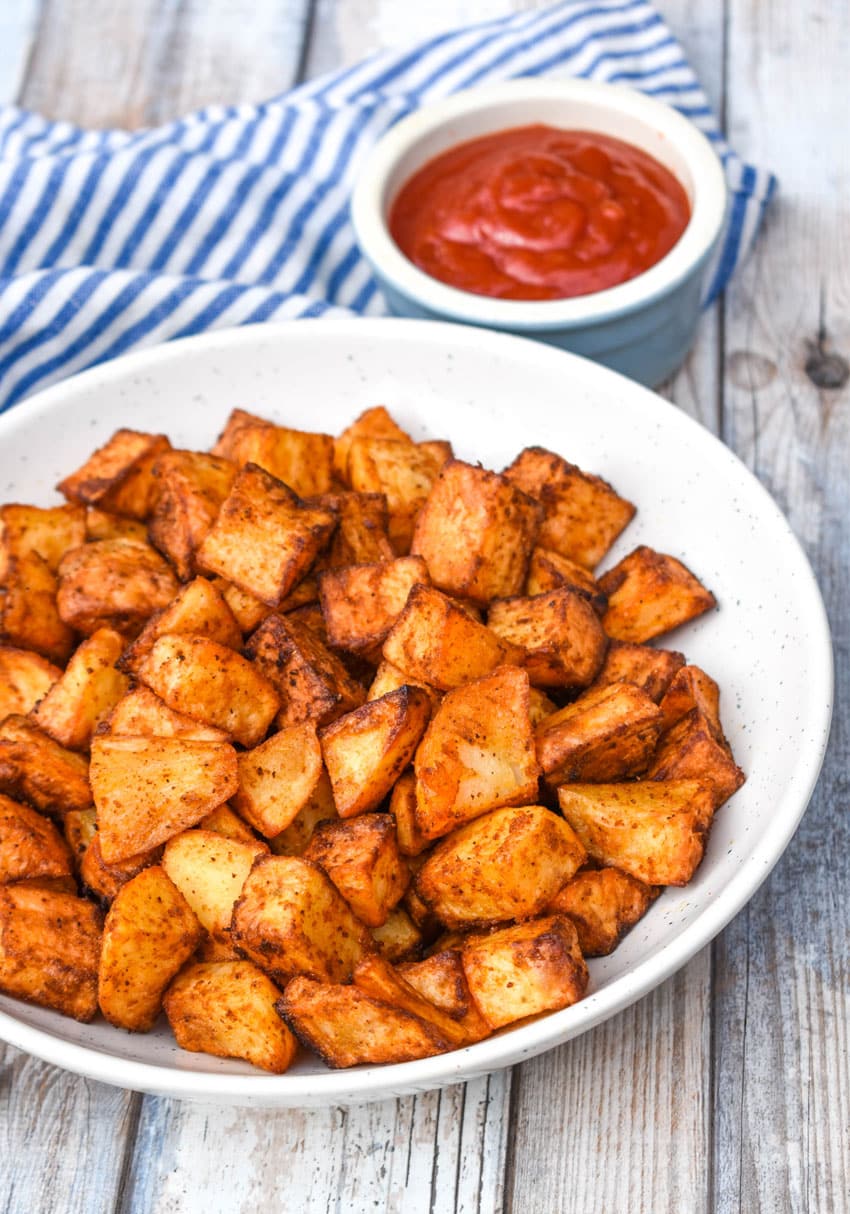 air fryer breakfast potatoes in a shallow white bowl