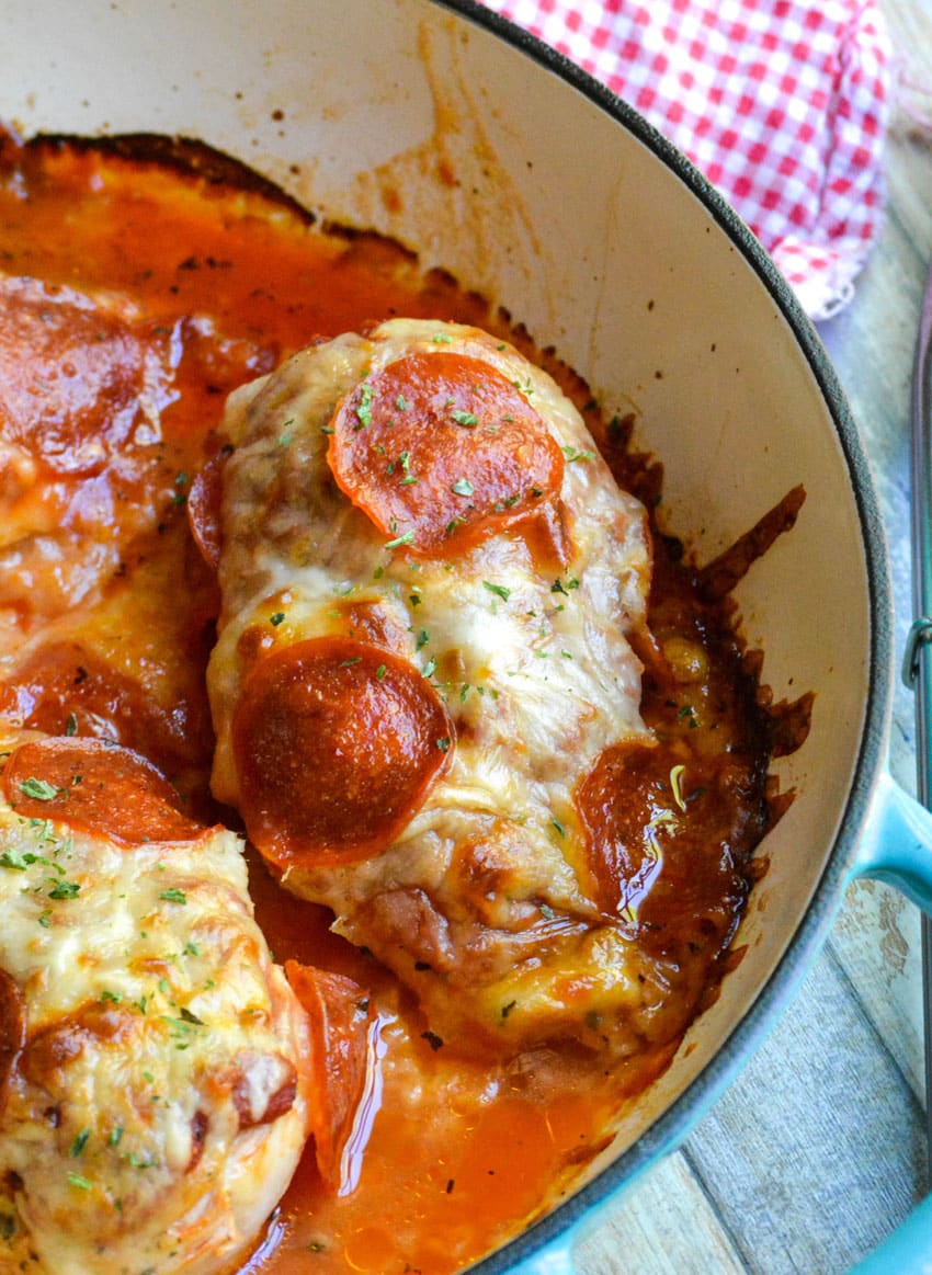 pepperoni topped baked pizza chicken in a cast iron skillet
