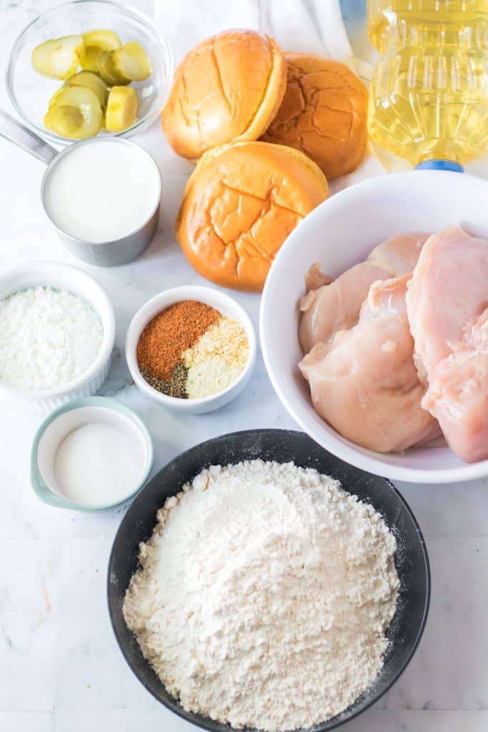 overhead image showing the measured ingredients needed to make a copycat popeye's chicken sandwich