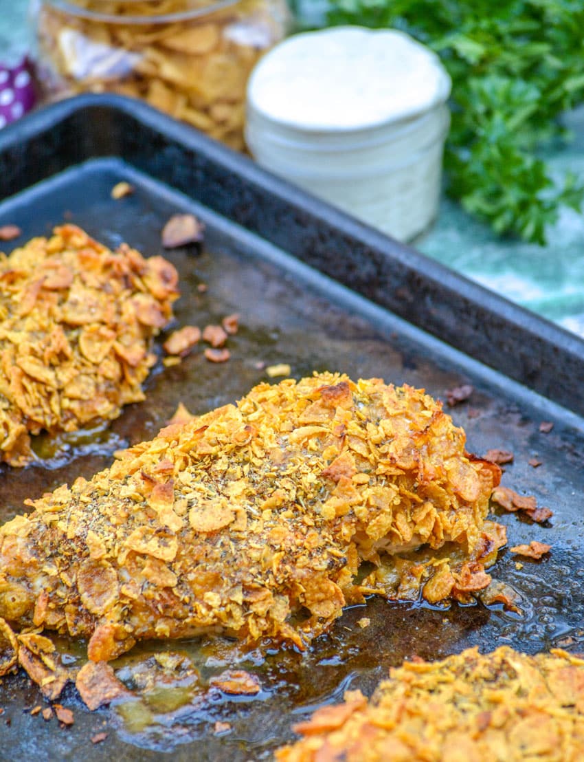 Crispy Cornflake Chicken crispy cornflake chicken on a metal baking sheet
