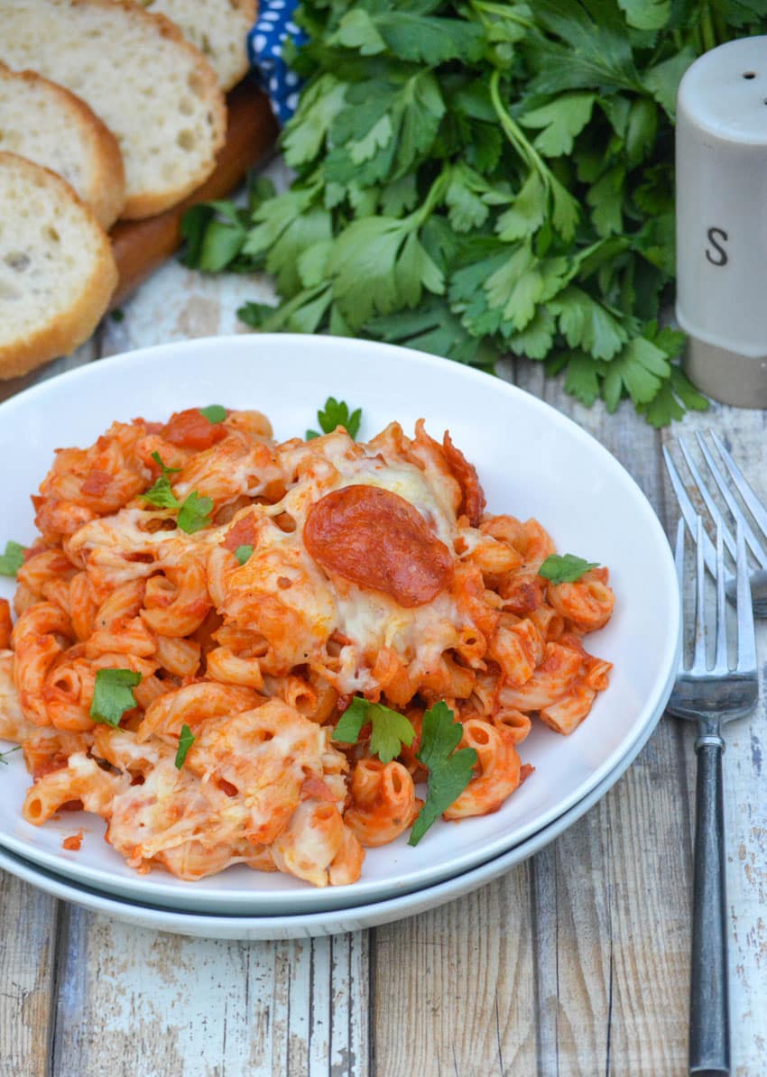 cheesy dump and bake pizza casserole in a white bowl