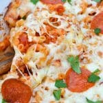 dump and bake pizza casserole in a white baking dish