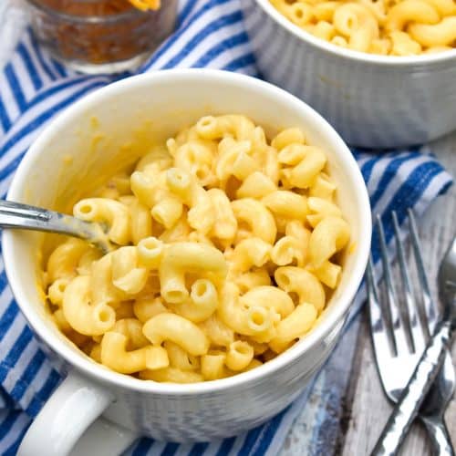 a silver fork stuck in a mug of homemade easy mac