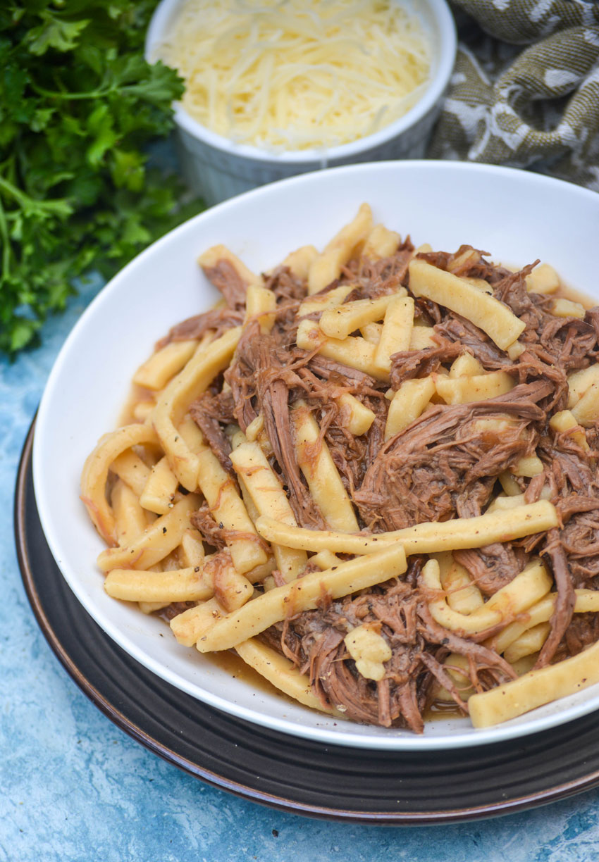 instant pot beef and noodles in a white bowl