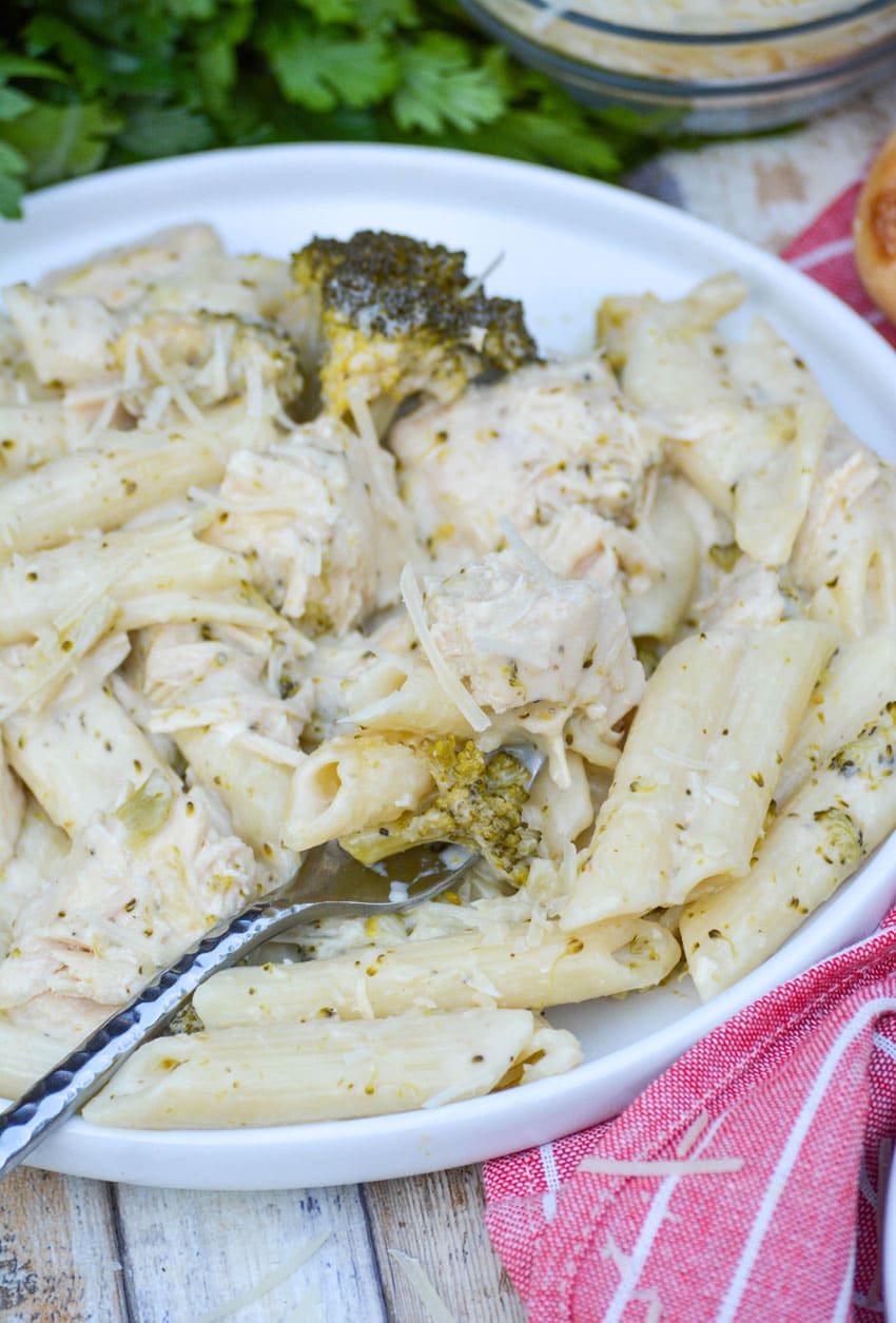 slow cooker chicken alfredo with broccoli served on a white plate