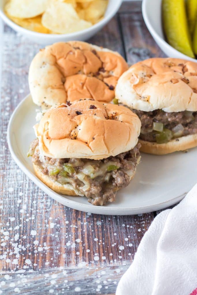 slow cooker philly cheesesteak sloppy joes on a white plate