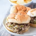 slow cooker philly cheesesteak sloppy joes on a white plate