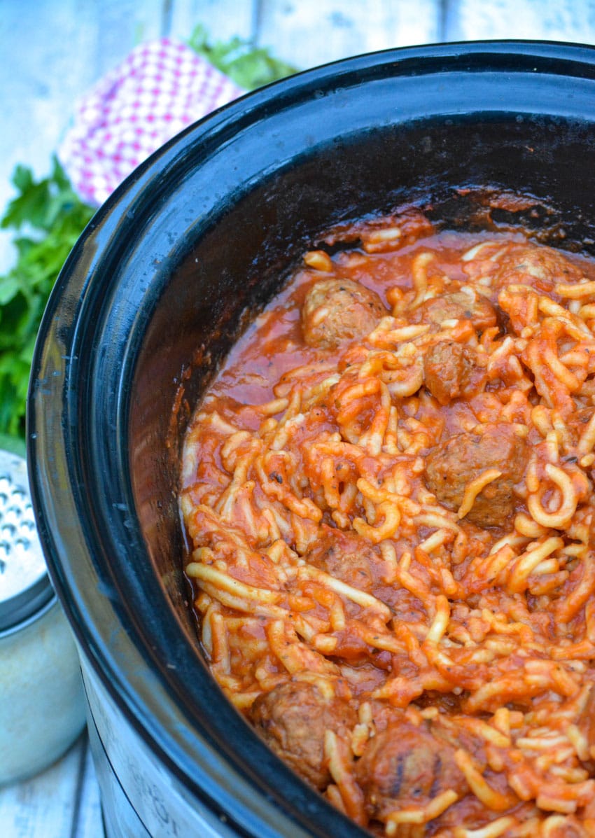 slow cooker spaghetti and meatballs in a black crockpot