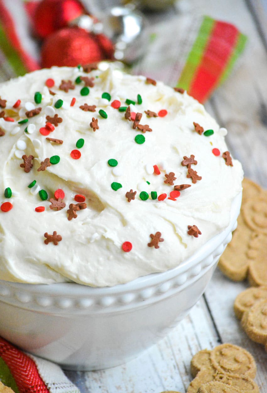 fluffy sugar cookie dip topped with sprinkles in a white bowl