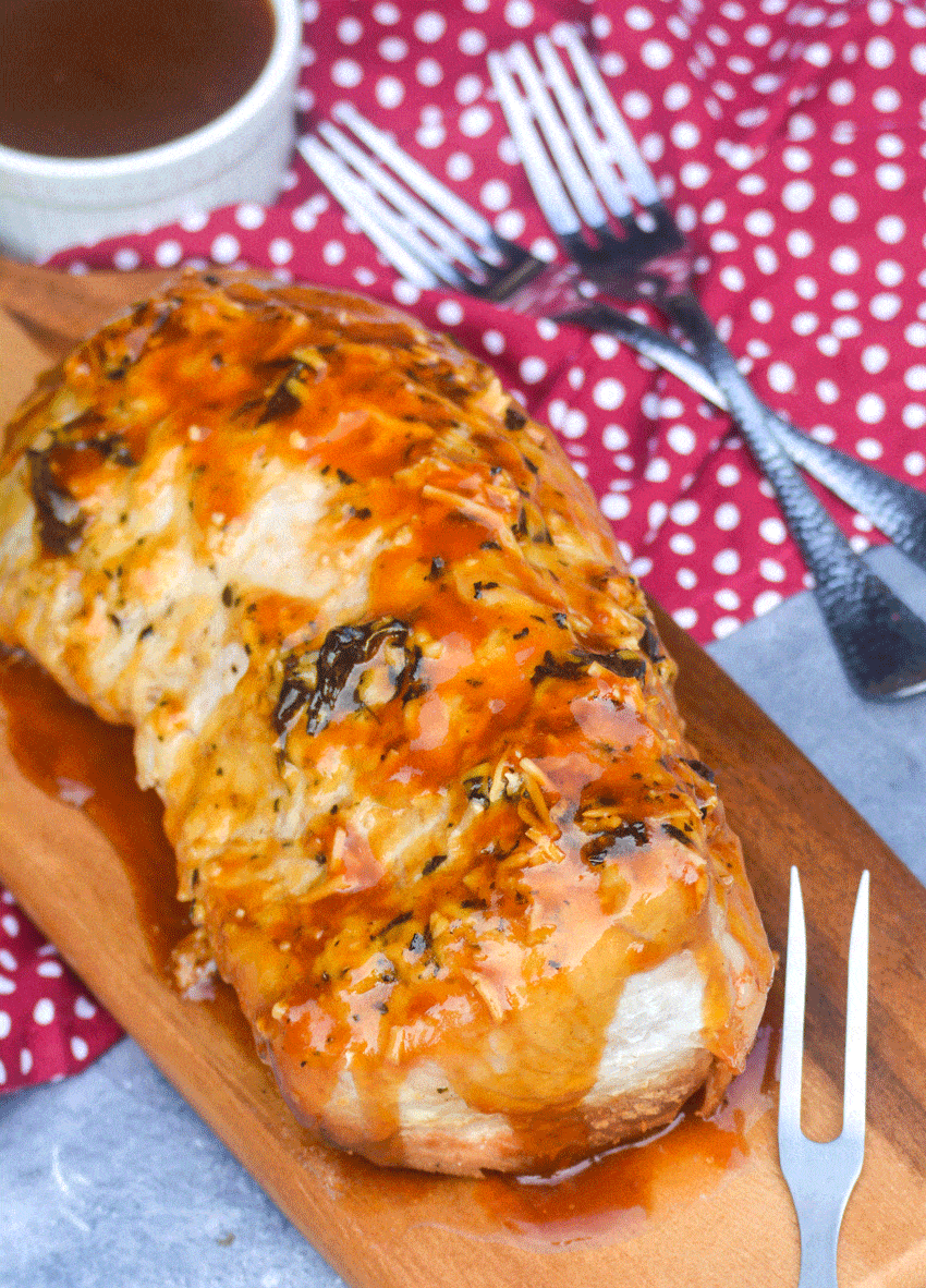 pork tenderloin slow cooker recipe on a wooden cutting board