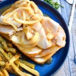 Diner Style Hot Turkey Sandwiches on a blue plate with crispy french fries on the side