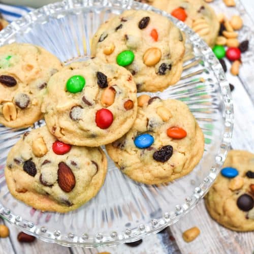 quick and easy trail mix cookies on a glass cake stand