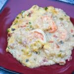shrimp and grits casserole on a red plate