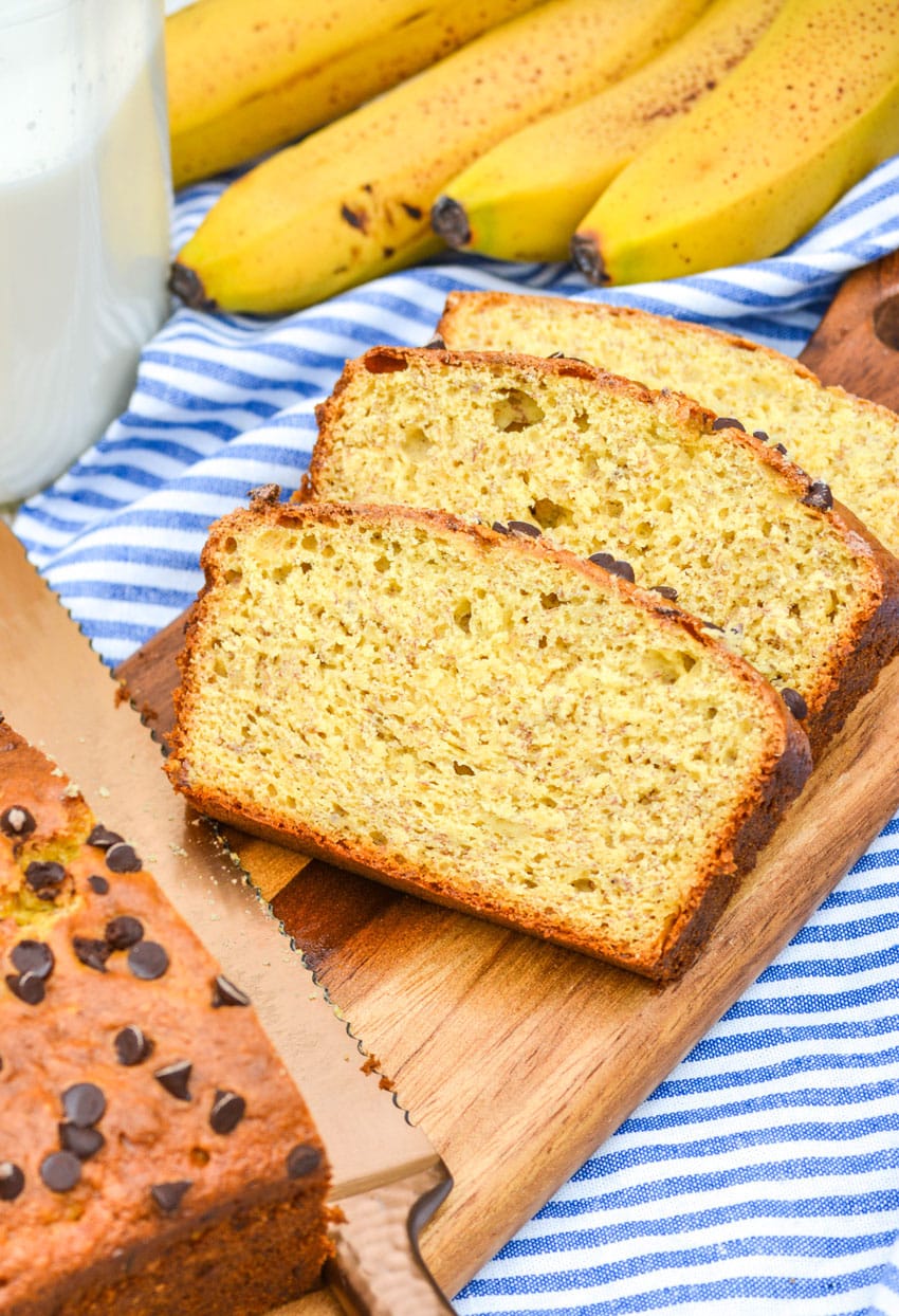 slices of three ingredient banana bread on a wooden cutting board