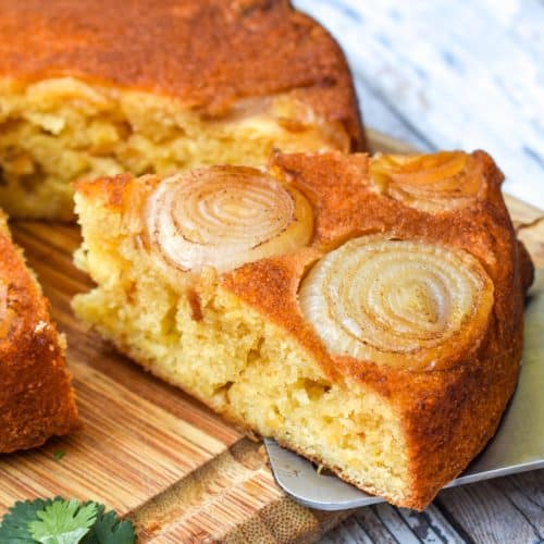 a slice of upside down cornbread on a silver spatula