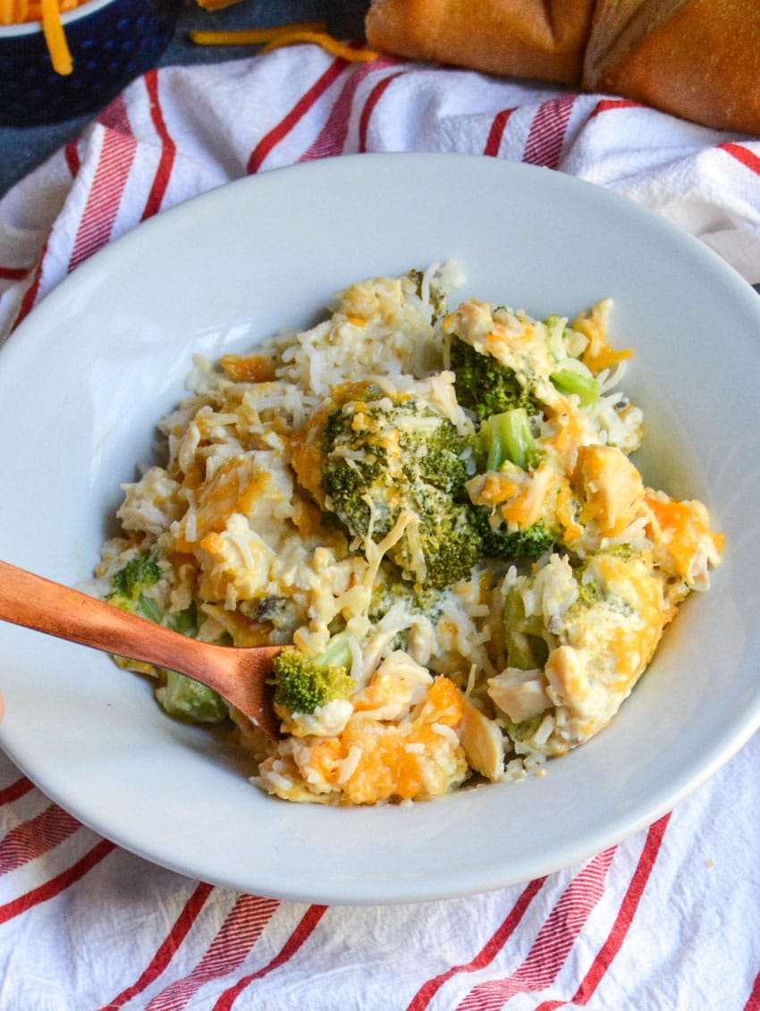cheesy chicken broccoli and rice casserole in a white bowl