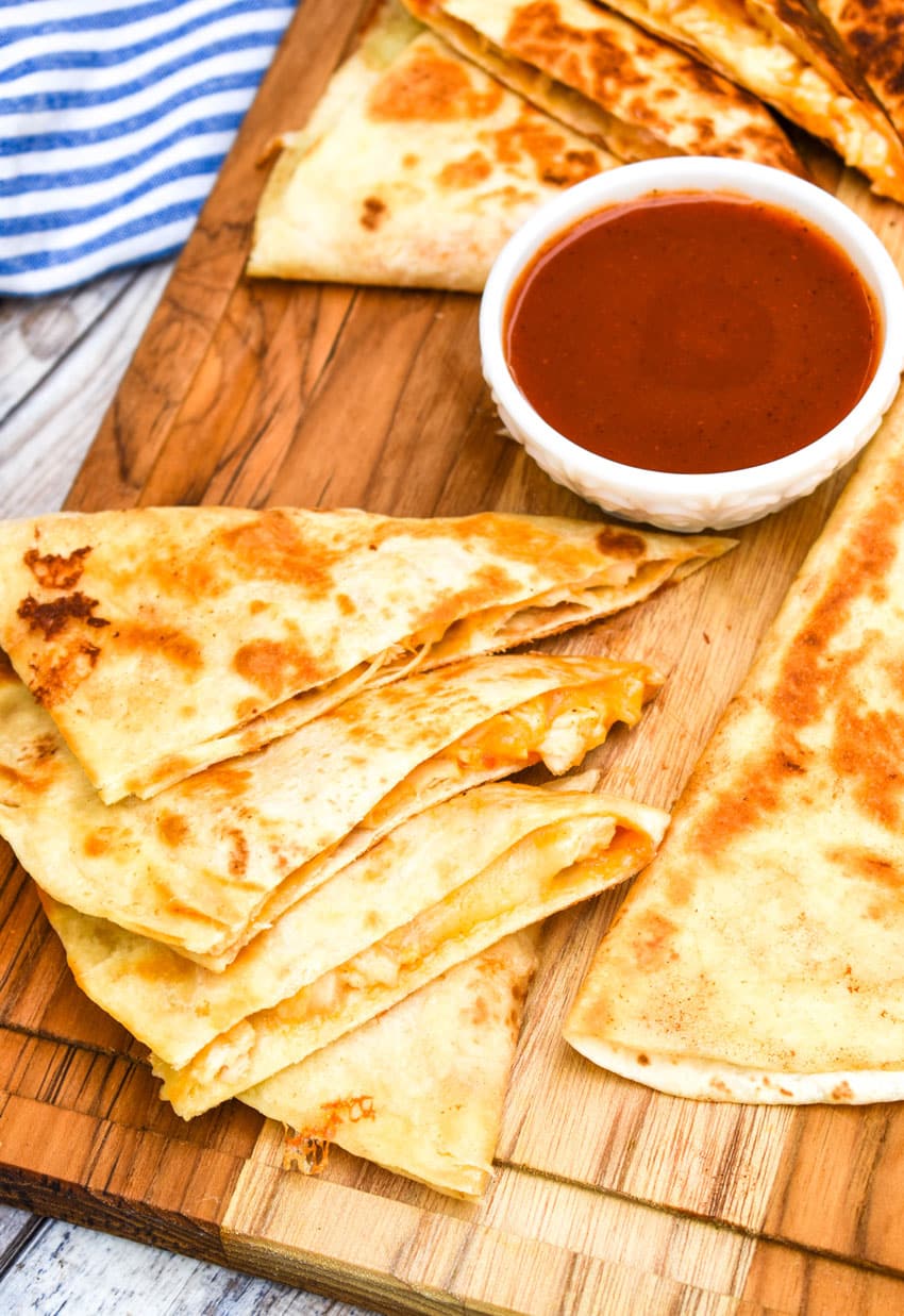 copycat Taco Bell chicken quesadilla on a wooden cutting board