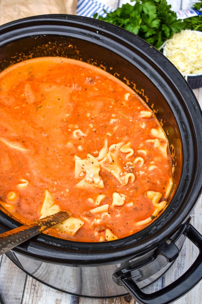 easy lasagna soup in the black bowl of a slow cooker
