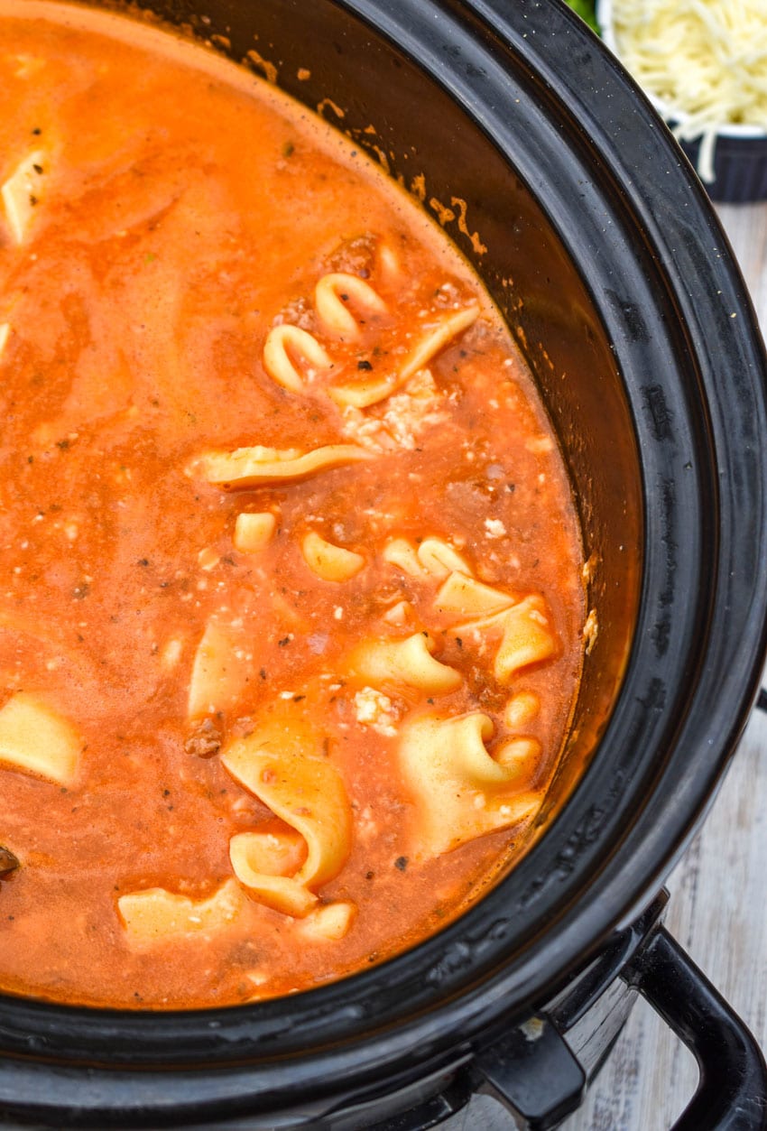 easy lasagna soup in the black bowl of a slow cooker