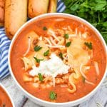a white bowl filled with slow cooker lasagna soup