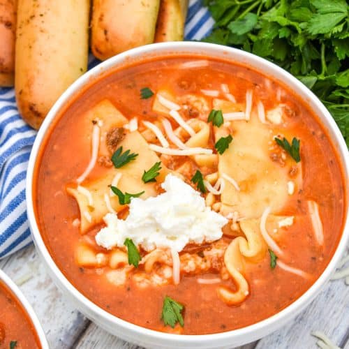 a white bowl filled with slow cooker lasagna soup