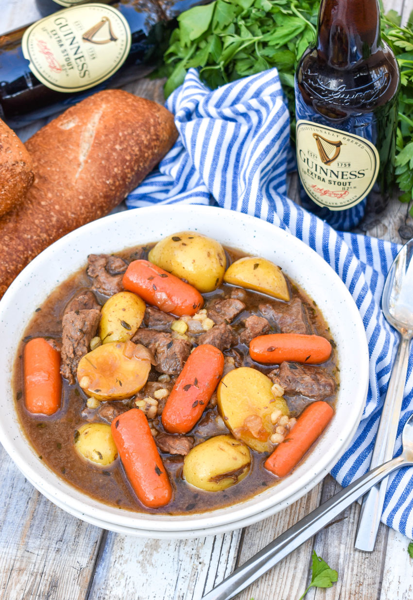 crockpot guinness beef stew in a white soup bowl
