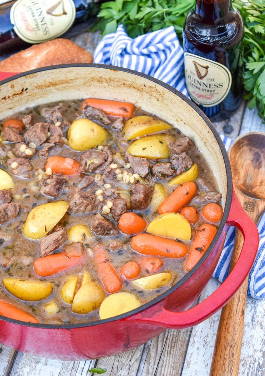 Irish beef stew with guinness beer in a red pot