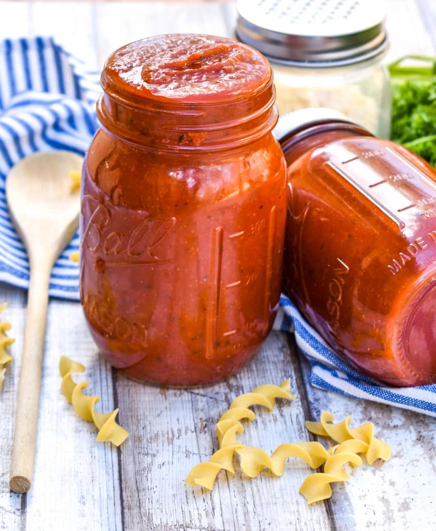 doctored canned tomato sauce in glass jars
