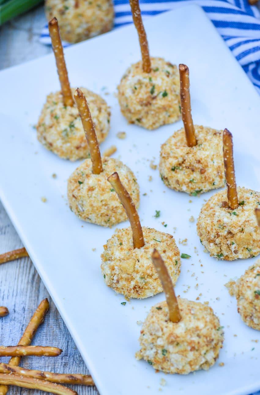 mini goat cheese balls on a white serving platter