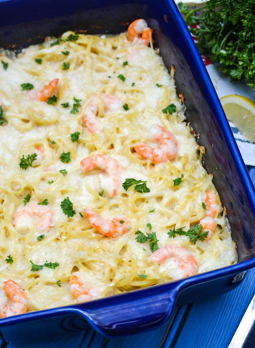 baked shrimp scampi casserole in a blue baking dish