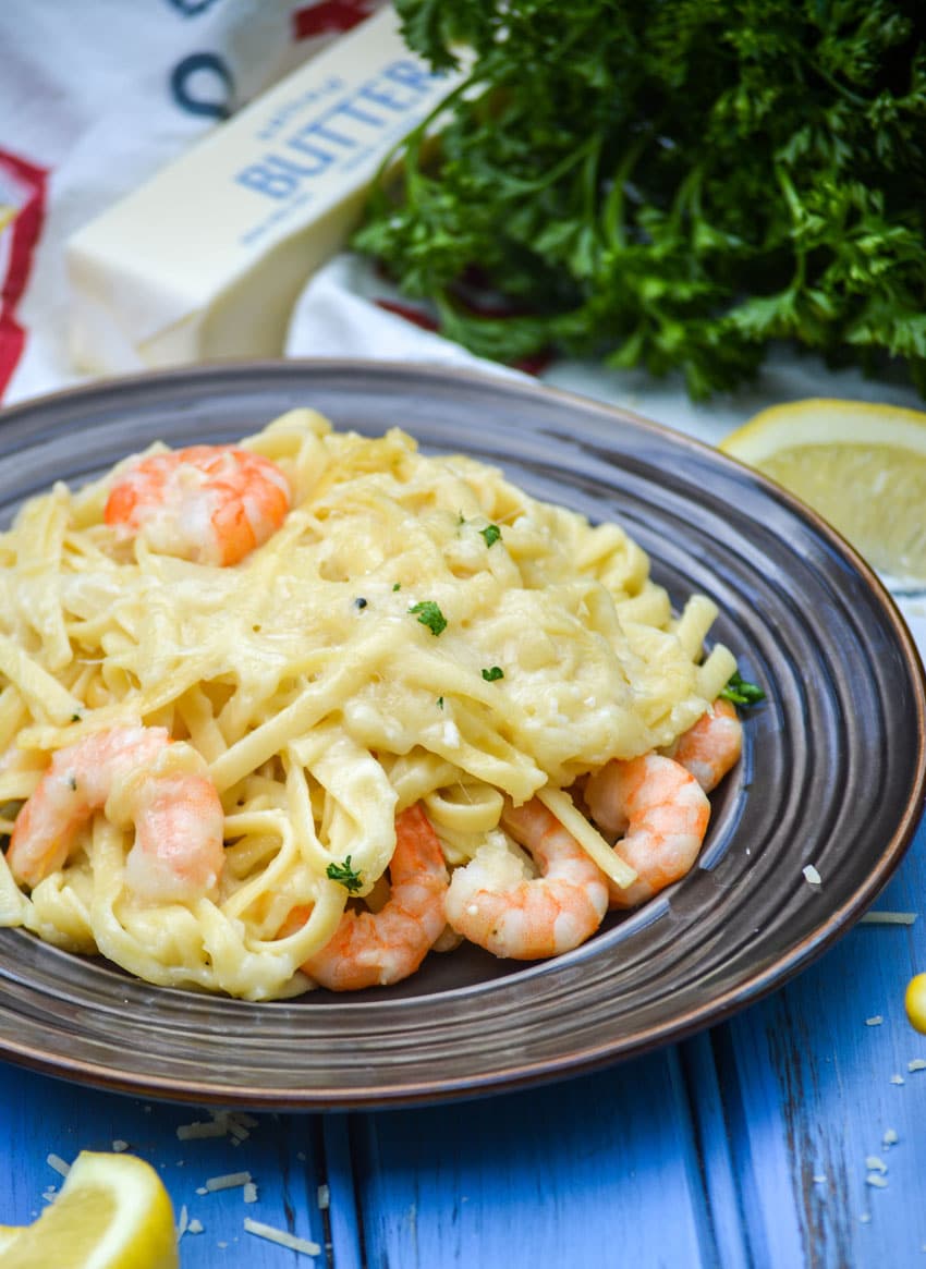 baked shrimp scampi casserole on a small brown plate