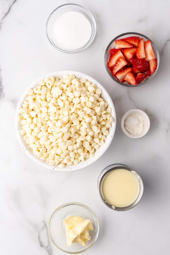 overhead image showing the measured ingredients needed to make a batch of strawberries and cream fudge