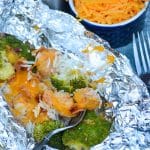 CHICKEN BROCCOLI AND RICE FOIL PACKETS with fork stuck in the middle