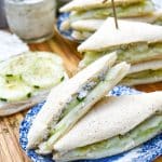 cucumber tea sandwich triangles on a blue and white saucer