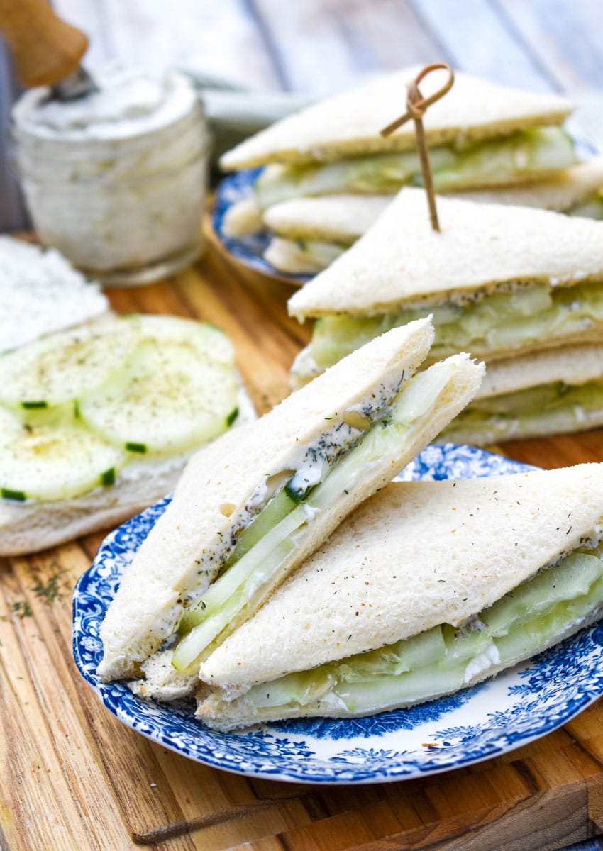 cucumber tea sandwich triangles on a blue and white saucer