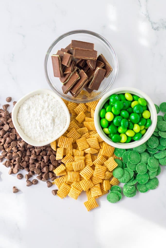 an overhead image showing the measured ingredients needed to make a batch of chocolate mint puppy chow