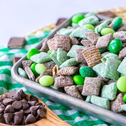 mint chocolate muddy buddies on a metal tray