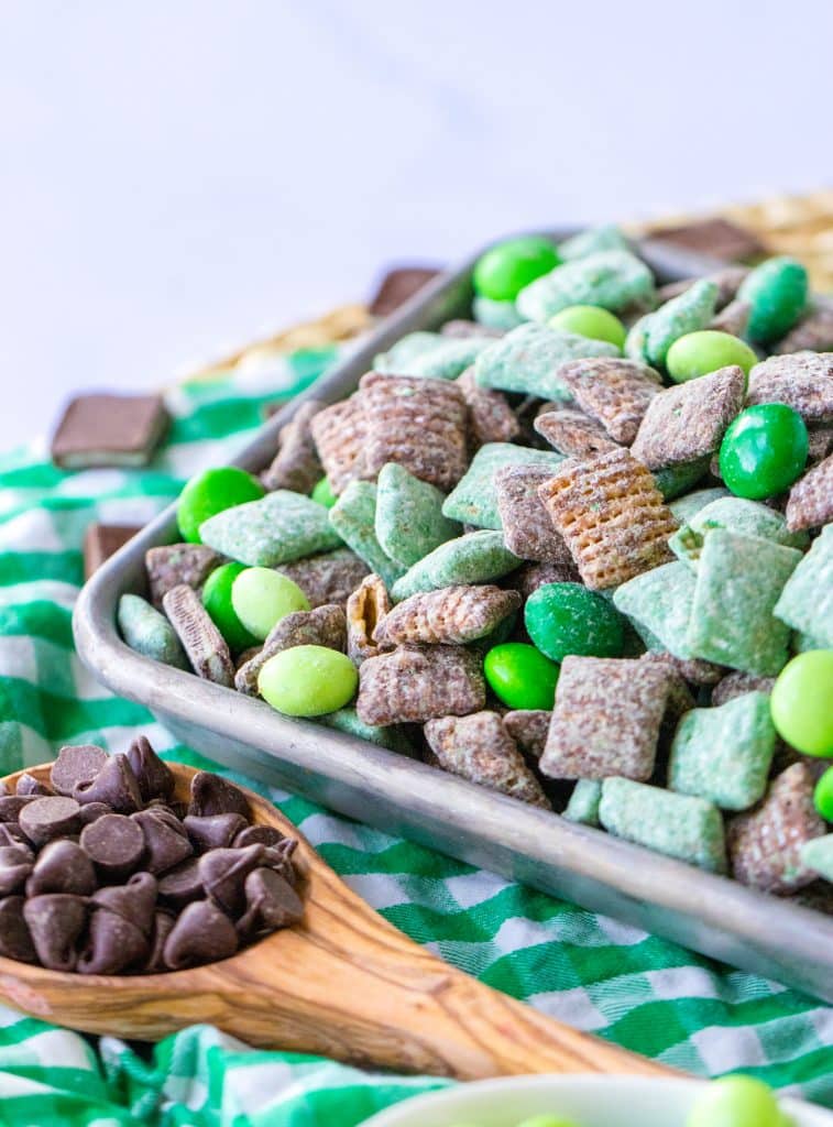 mint chocolate muddy buddies on a metal tray