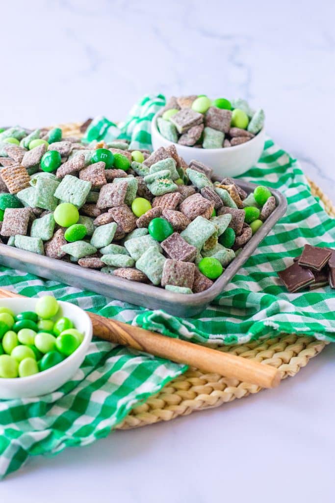 mint chocolate muddy buddy snack mix in a metal tray