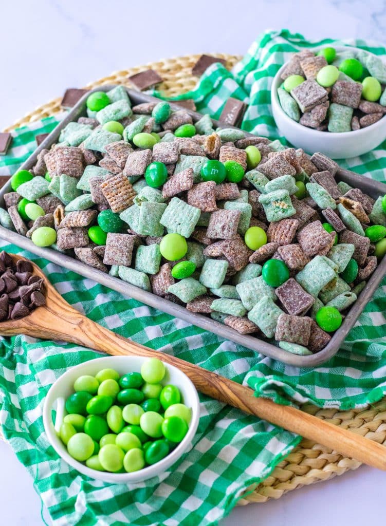 mint chocolate muddy buddies on a metal tray