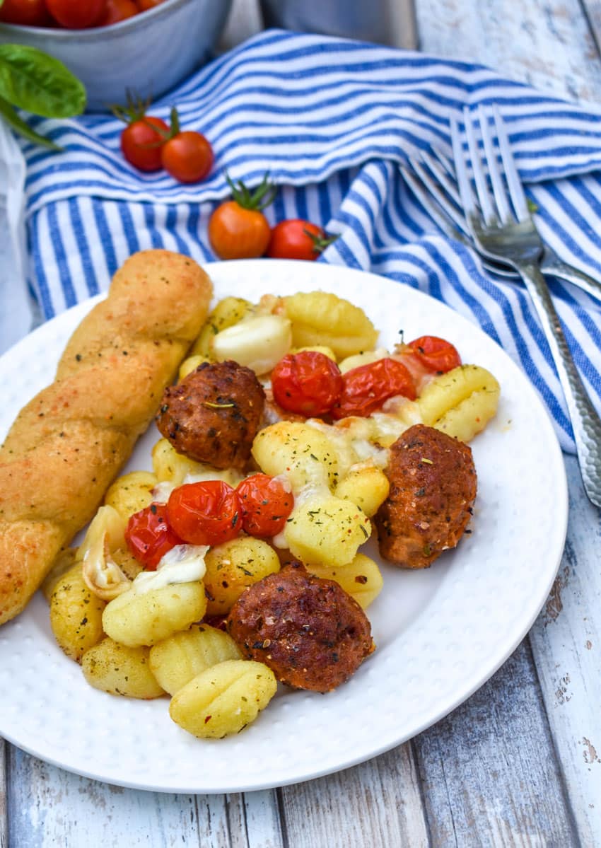 sheet pan baked gnocchi on a white dinner plate