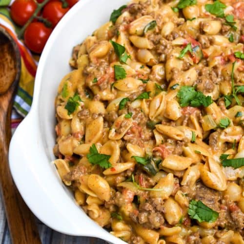 taco mac and cheese in a white serving bowl