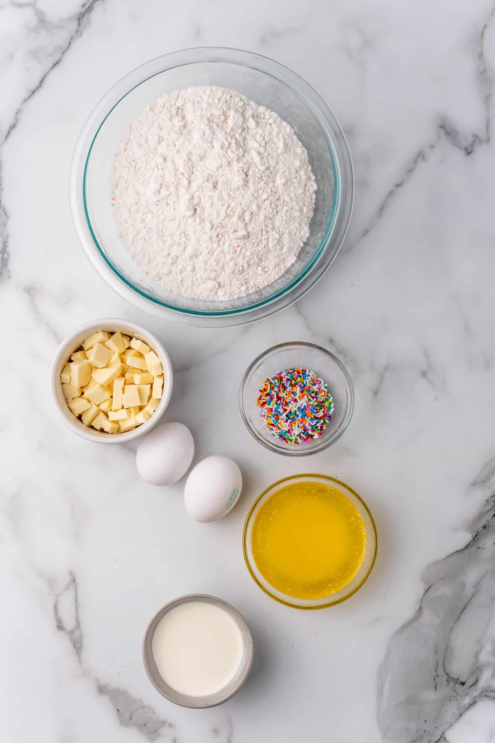 overhead image showing the measured ingredients needed to make a batch of cake batter blondies