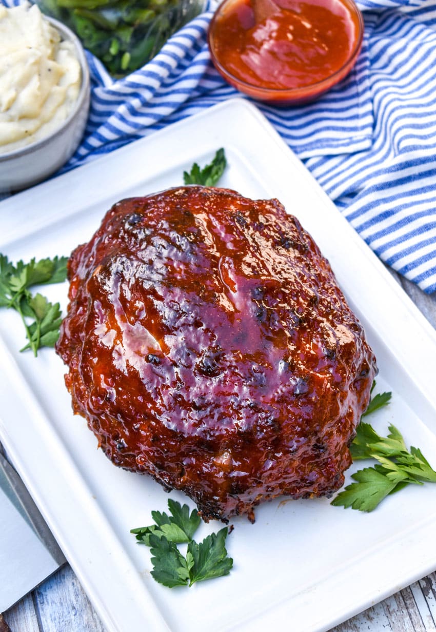 Air Fryer Meatloaf (Copycat Cracker Barrel Recipe) air fryer meatloaf on a small white platter