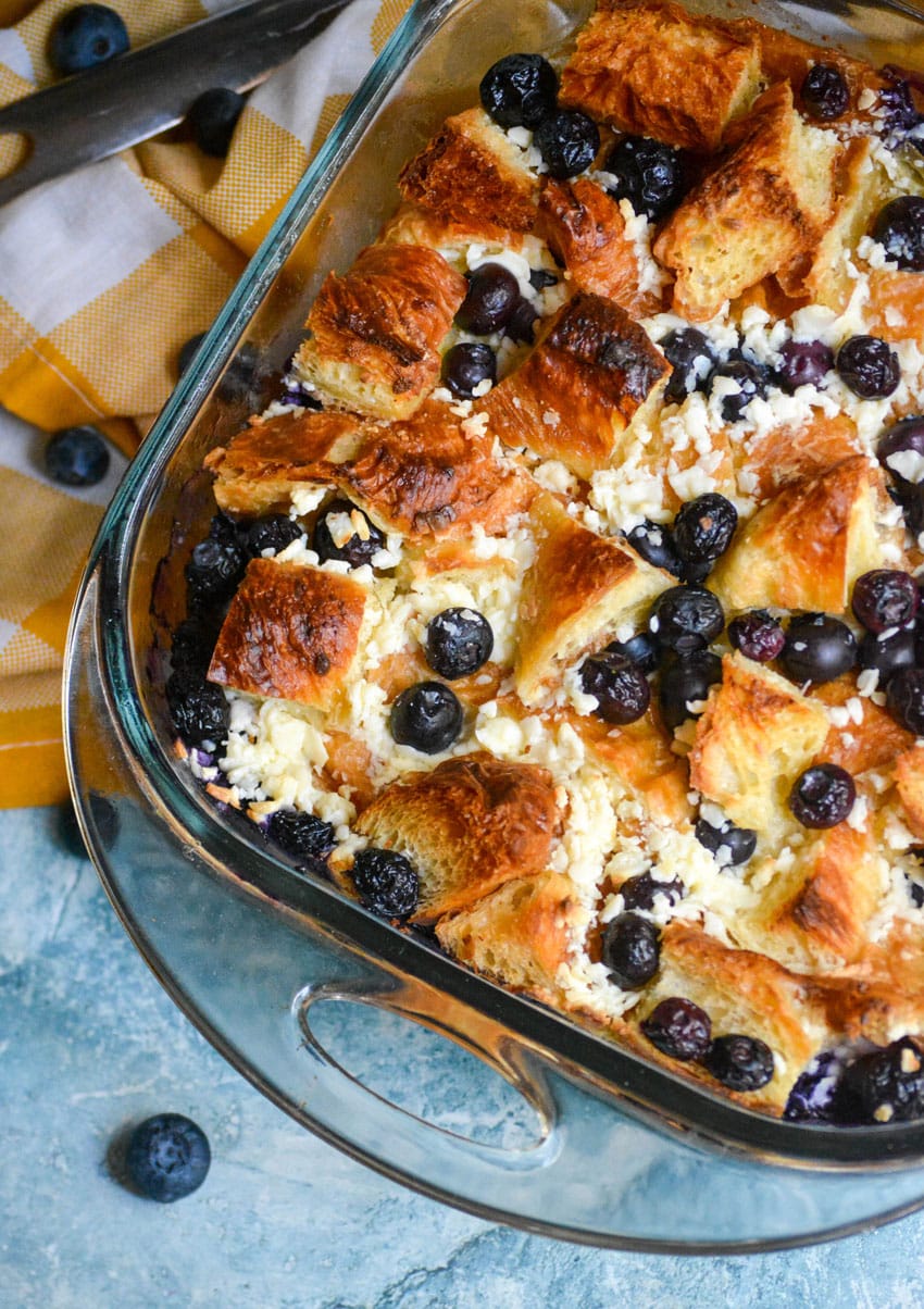 blueberry croissant bake in a glass baking dish