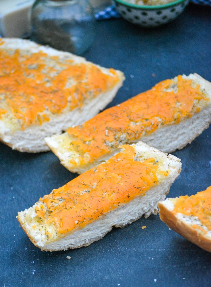 slices of cheesy ranch bread on a slate cutting board